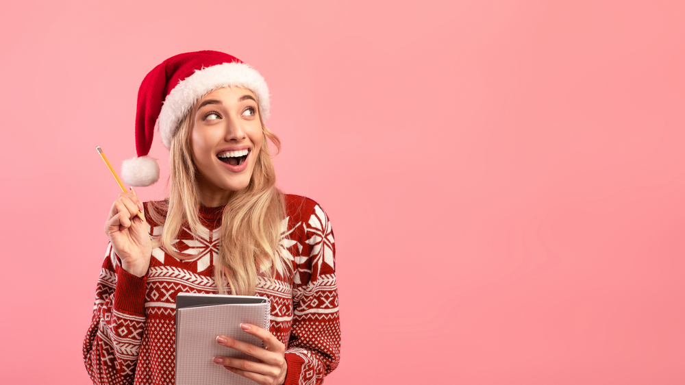 Excited,Millennial,Lady,In,Christmas,Outfit,Writing,New,Year,Resolutions