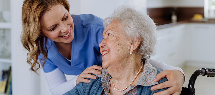 Portrait Of Nurse And Her Senior Client On Wheelchair. Portrait Of Nurse And Her Senior Client On Wheelchair.