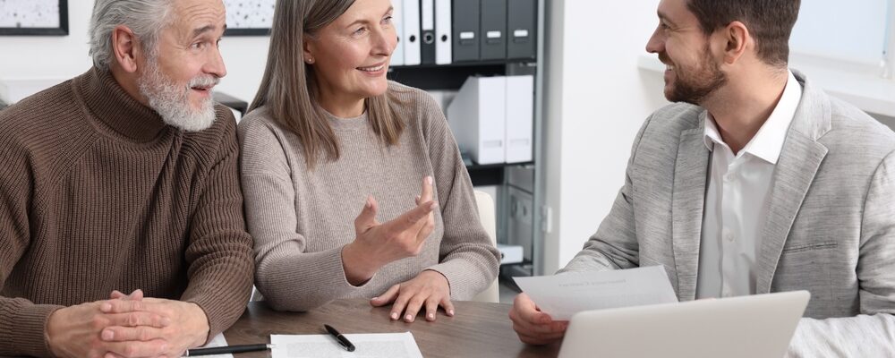 Elderly,Couple,Consulting,Insurance,Agent,About,Pension,Plan,At,Wooden Elderly,Couple,Consulting,Insurance,Agent,About,Pension,Plan,At,Wooden