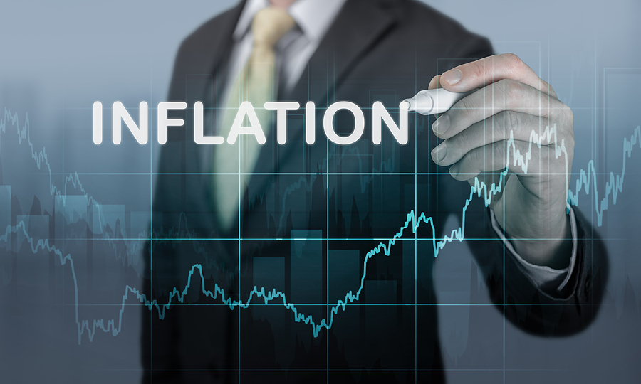Businessman Writes Word Inflation Against Background Of Graph Ch Businessman Writes Word Inflation Against Background Of Graph Ch